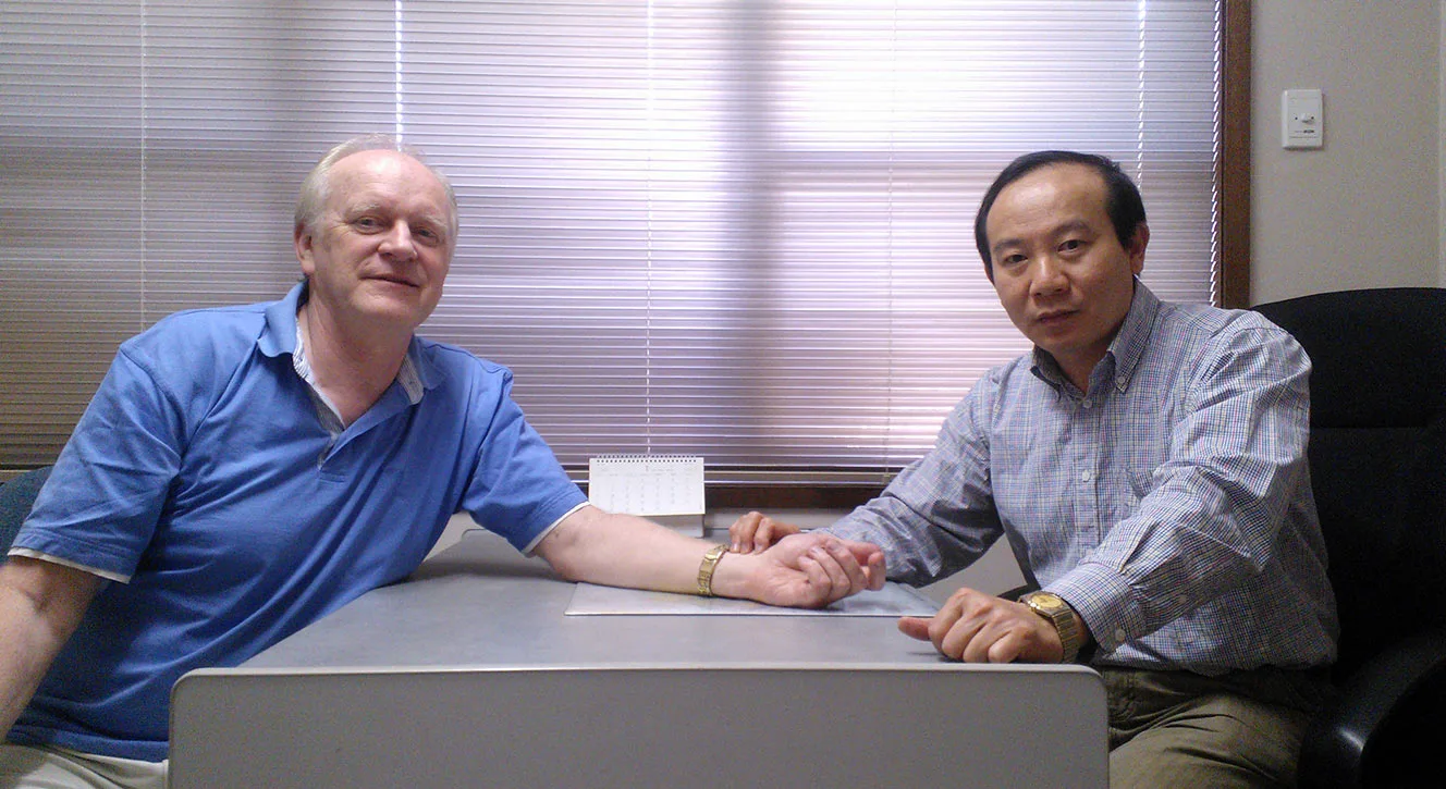 Dr Jim Xing taking a patient's wrist pulse in an Evergreen consulting room
