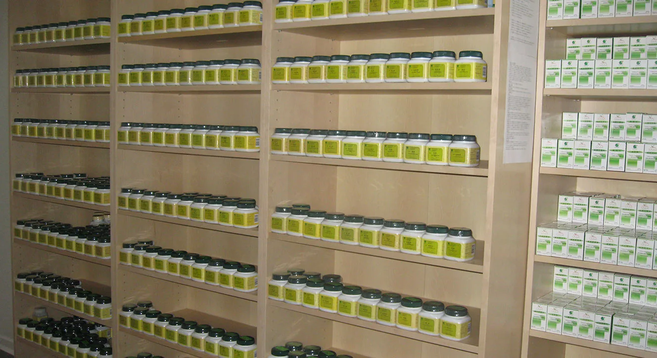 Floor-to-ceiling shelves of numbered herbal remedy jars in the Evergreen dispensary